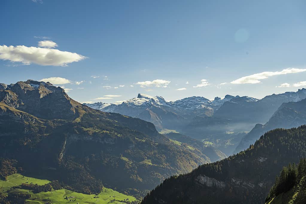 a valley between mountains, switzerland with kids